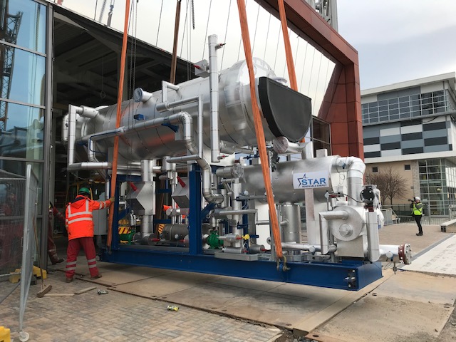 Star Renewable Energy heatpump being manoeuvred into place at a new development in Glasgow during covid/ Andy Pearson private collection